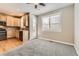 Bright eat-in kitchen area featuring hardwood floors, white door, and a view to the outside at 10311 Belvedere Ln, Lone Tree, CO 80124