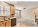 Bright living room boasts carpet floors, a ceiling fan, neutral walls, and a window with lovely shutters at 10311 Belvedere Ln, Lone Tree, CO 80124