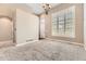 Open-concept living room featuring carpet, lots of light and neutral wall color at 10311 Belvedere Ln, Lone Tree, CO 80124