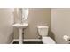 Cozy powder room featuring tile floor, pedestal sink, and neutral paint at 10311 Belvedere Ln, Lone Tree, CO 80124