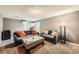 Finished basement featuring gray couches and a rustic wooden coffee table at 8361 Mason Cir, Westminster, CO 80031