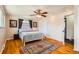Cozy bedroom with hardwood floors, a ceiling fan, and natural light at 8361 Mason Cir, Westminster, CO 80031