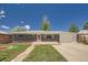 Charming brick home featuring a lush lawn, stone walkway, and attached two-car garage at 8361 Mason Cir, Westminster, CO 80031