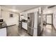 Bright kitchen boasting stainless steel appliances, white cabinetry and tile backsplash at 8361 Mason Cir, Westminster, CO 80031
