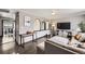 Cozy living room featuring comfortable seating and stylish entertainment center at 8361 Mason Cir, Westminster, CO 80031