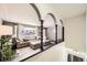 Bright living room featuring arched details, comfortable seating and natural light at 8361 Mason Cir, Westminster, CO 80031