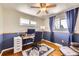 Office space featuring hardwood floors, white and blue walls, and windows at 8361 Mason Cir, Westminster, CO 80031