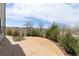 Backyard concrete patio with lush greenery and well-maintained landscaping at 19060 E 54Th Pl, Denver, CO 80249