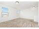 Bright bedroom with two large windows and neutral carpeting at 19060 E 54Th Pl, Denver, CO 80249