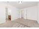 Spacious bedroom with plush carpet, white walls, and access to a bathroom at 19060 E 54Th Pl, Denver, CO 80249