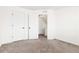 Spacious bedroom with neutral carpeting and an open doorway at 19060 E 54Th Pl, Denver, CO 80249