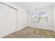 Bedroom with two windows providing natural light and closet with sliding doors at 19060 E 54Th Pl, Denver, CO 80249