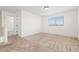 Bright bedroom with neutral carpeting and a large window for natural light at 19060 E 54Th Pl, Denver, CO 80249