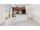 Bright kitchen with stainless appliances, ample counter space, and a sliding door to an outdoor area at 19060 E 54Th Pl, Denver, CO 80249