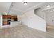 Open-concept kitchen with stainless appliances and wood cabinets seamlessly connected to the dining area at 19060 E 54Th Pl, Denver, CO 80249