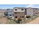 Rear exterior view of house with sliding glass door, patio and fenced yard at 19060 E 54Th Pl, Denver, CO 80249