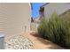 Side yard path with rock detail and healthy, manicured landscaping at 19060 E 54Th Pl, Denver, CO 80249
