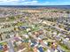 Expansive aerial view of a neighborhood, showcasing the property's location and surrounding community with a view of the city at 7737 S Dover St, Littleton, CO 80128
