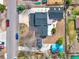 Aerial view of home showcasing roof, backyard deck, and lush landscaping at 7737 S Dover St, Littleton, CO 80128