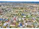 Wide aerial shot of the property and neighborhood, highlighting the landscape, nearby roads, and community layout at 7737 S Dover St, Littleton, CO 80128