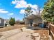 Spacious backyard with a gravel area and covered storage at 7737 S Dover St, Littleton, CO 80128