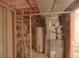 Basement with water heater and HVAC system, plus some shelves for storage at 7737 S Dover St, Littleton, CO 80128