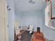 Bathroom being remodeled with new toilet, lighting fixture, and tile at 7737 S Dover St, Littleton, CO 80128