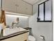 This bathroom features an updated sink, toilet, cabinet and fixtures at 7737 S Dover St, Littleton, CO 80128