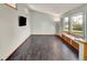 Bright living room with new hardwood floors and large window seating area at 7737 S Dover St, Littleton, CO 80128