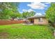 Large backyard with ample lawn space and a cozy patio area for relaxing and entertaining at 1060 S Harrison St, Denver, CO 80209