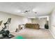Finished basement with cozy carpet, neutral walls, and spotlights for a welcoming atmosphere at 1060 S Harrison St, Denver, CO 80209