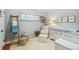 Cozy Bedroom with a crib, chair, ottoman, and a window at 1060 S Harrison St, Denver, CO 80209