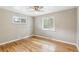 This is a light and airy bedroom featuring hardwood floors and natural light at 1060 S Harrison St, Denver, CO 80209