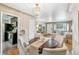 Dining area with stylish light fixture, hardwood floors and seating for four at 1060 S Harrison St, Denver, CO 80209