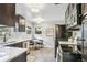 This kitchen features black appliances and a dining nook at 1060 S Harrison St, Denver, CO 80209