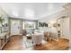 Bright and airy living room with hardwood floors, neutral paint, and comfortable furniture at 1060 S Harrison St, Denver, CO 80209