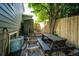 Private backyard features a picnic table, shed, and lush landscaping at 1932 Sandhurst Dr, Castle Rock, CO 80104