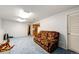 Cozy finished basement featuring a large seating area and kitchenette access at 1932 Sandhurst Dr, Castle Rock, CO 80104
