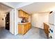 Basement kitchenette with wooden cabinets and updated appliances at 1932 Sandhurst Dr, Castle Rock, CO 80104