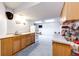 Basement kitchenette with light wood cabinets and open layout at 1932 Sandhurst Dr, Castle Rock, CO 80104