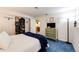 Bedroom boasts soft lighting, mounted TV, and access to the en suite bathroom at 1932 Sandhurst Dr, Castle Rock, CO 80104