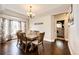 Formal dining room with hardwood floors, chandelier, and a table with seating for six at 1932 Sandhurst Dr, Castle Rock, CO 80104