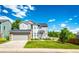 Charming two-story home with a well-manicured lawn and attached two-car garage at 1932 Sandhurst Dr, Castle Rock, CO 80104