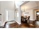 Welcoming foyer with hardwood floors, a view into dining room, and front door at 1932 Sandhurst Dr, Castle Rock, CO 80104