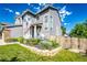 Beautifully landscaped front yard with stone edging and lush greenery at 1932 Sandhurst Dr, Castle Rock, CO 80104