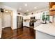 Spacious kitchen featuring stainless steel appliances, white cabinetry and lots of storage space at 1932 Sandhurst Dr, Castle Rock, CO 80104