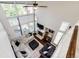 High-angle view of the living room, showcasing the fireplace and tall windows at 1932 Sandhurst Dr, Castle Rock, CO 80104