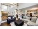 Spacious living room with hardwood floors, comfortable seating, and open layout at 1932 Sandhurst Dr, Castle Rock, CO 80104
