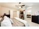 Cozy bedroom with comfortable furnishings, soft lighting and access to a bathroom at 1932 Sandhurst Dr, Castle Rock, CO 80104