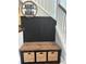 Staircase nook with black wainscoting and storage bench with decorative baskets at 1932 Sandhurst Dr, Castle Rock, CO 80104
